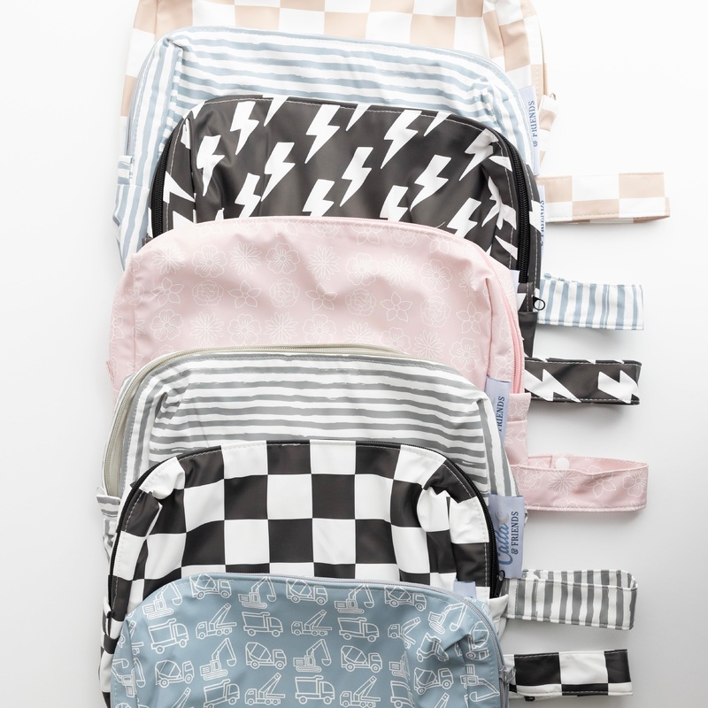 Everything Wet Bag|Brush Stripes – Powder Blue|Brush Stripes – Petal Pink|Brush Stripes – Cloud Gray|Blossom – Petal Pink|Trucks & Diggers – Powder Blue|Checkered – Blackout|Checkered – Khaki|Bolt – Blackout